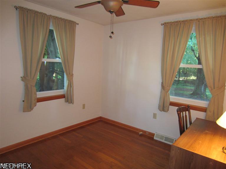 5407 Pleasant Avenue North Ridgeville, OH 44039 - Photo 13 of 17 2nd Bedroom on the 1st floor with hardwood floors.