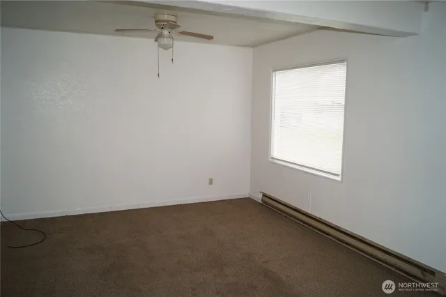 a view of an empty room and closet area