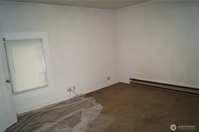 an empty room with a bench