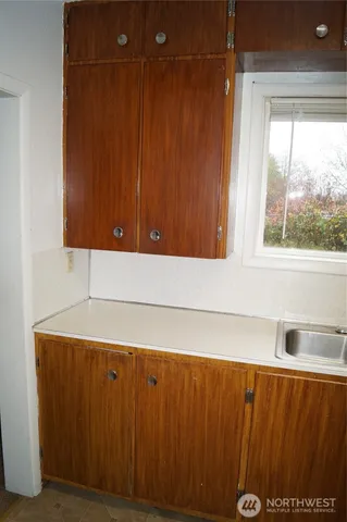 a kitchen with stainless steel appliances a refrigerator and a sink
