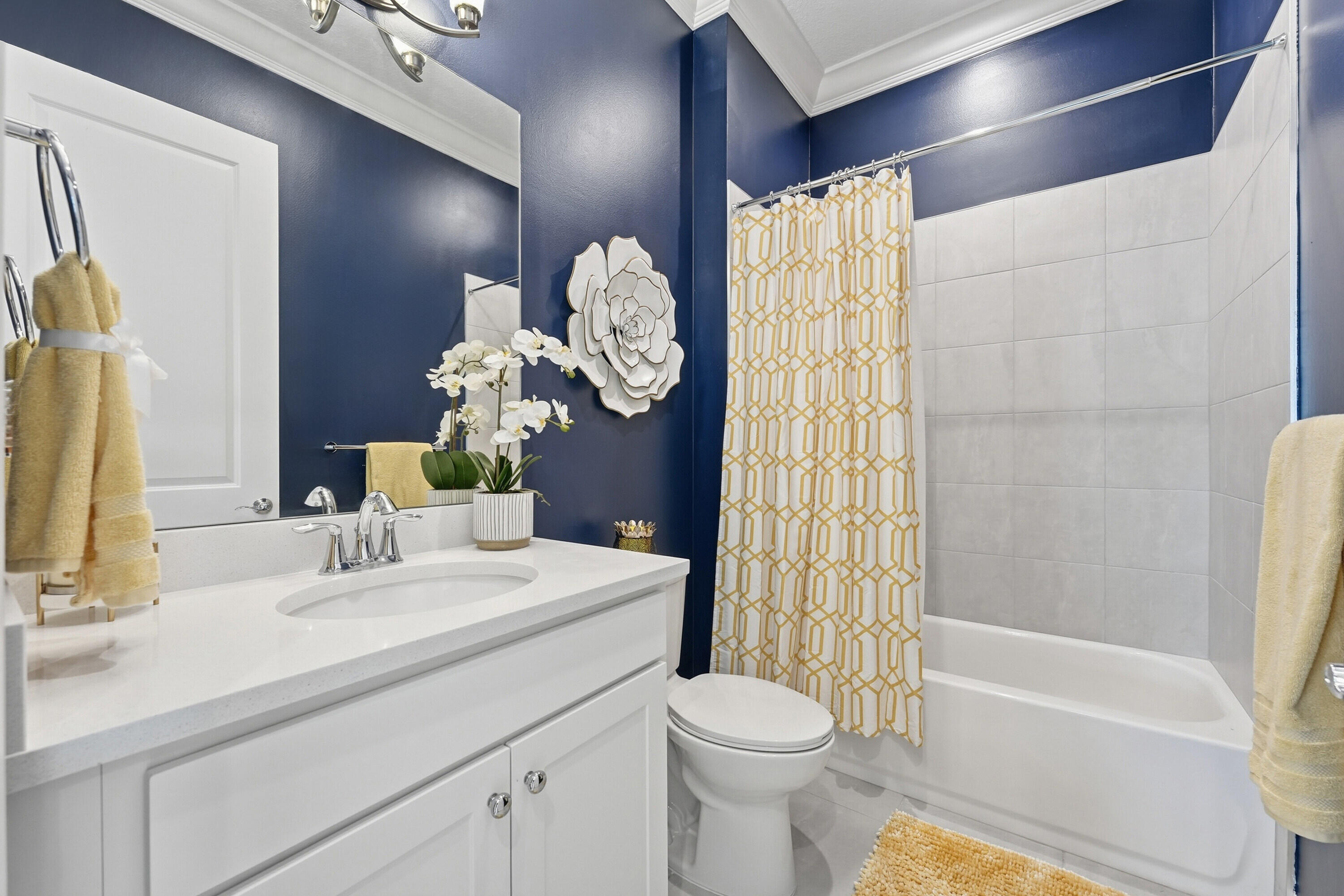 9321 Southwest Pepoli Way Port St. Lucie, FL 34987 - Photo 19 of 65 a bathroom with a sink a toilet and shower