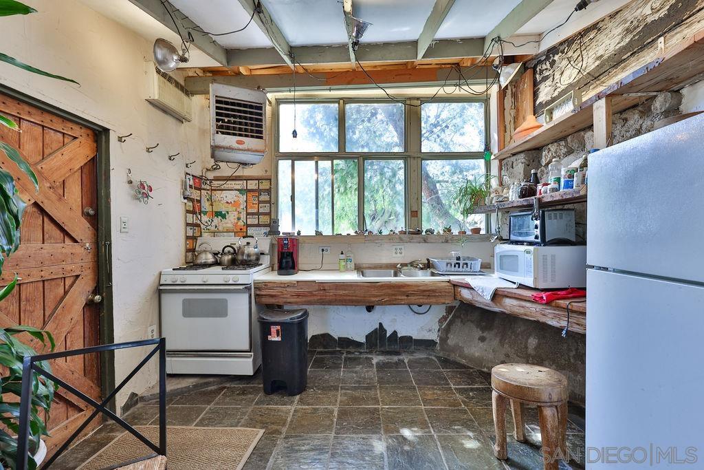 0 Tower & 3 Homes Jacumba, CA 91934 - Photo 12 of 41 a work place with a large window and table chair