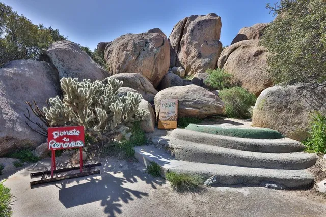 a view of balcony with table and chairs