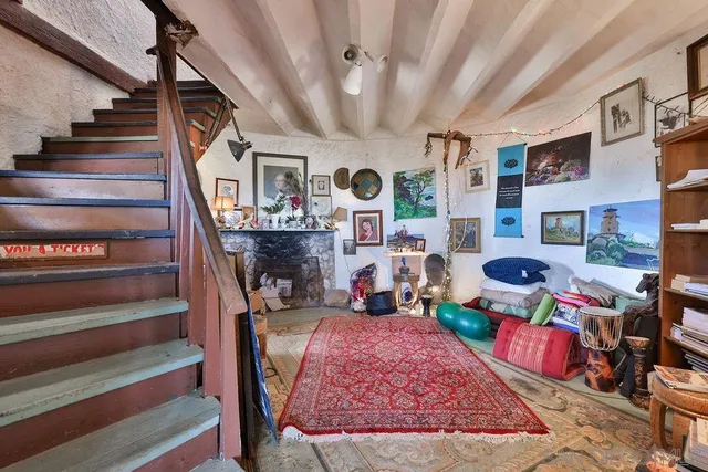 a living room with lots of furniture and a rug