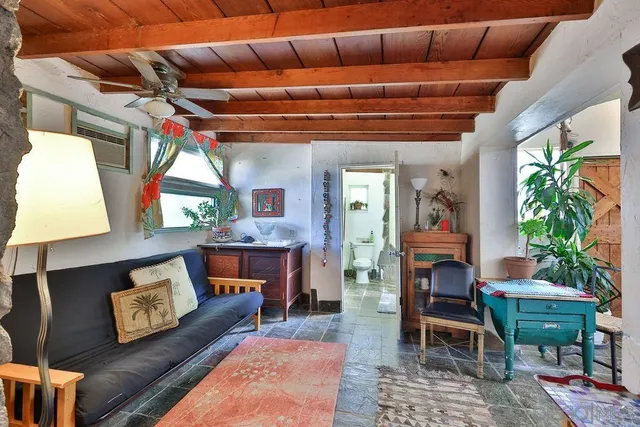 a outdoor living space with furniture and a fireplace