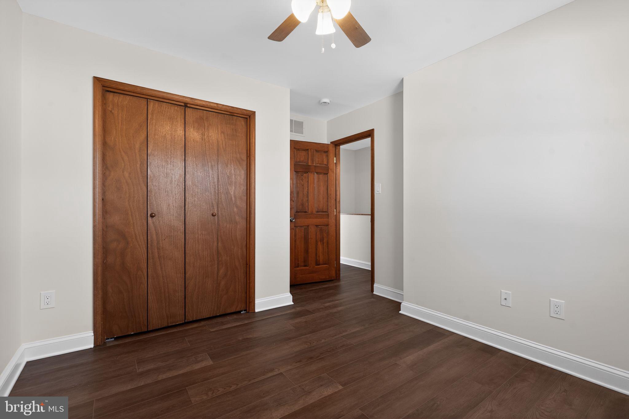 511 3rd Avenue Audubon, NJ 08106 - Photo 12 of 23 an empty room with wooden floor closet and windows