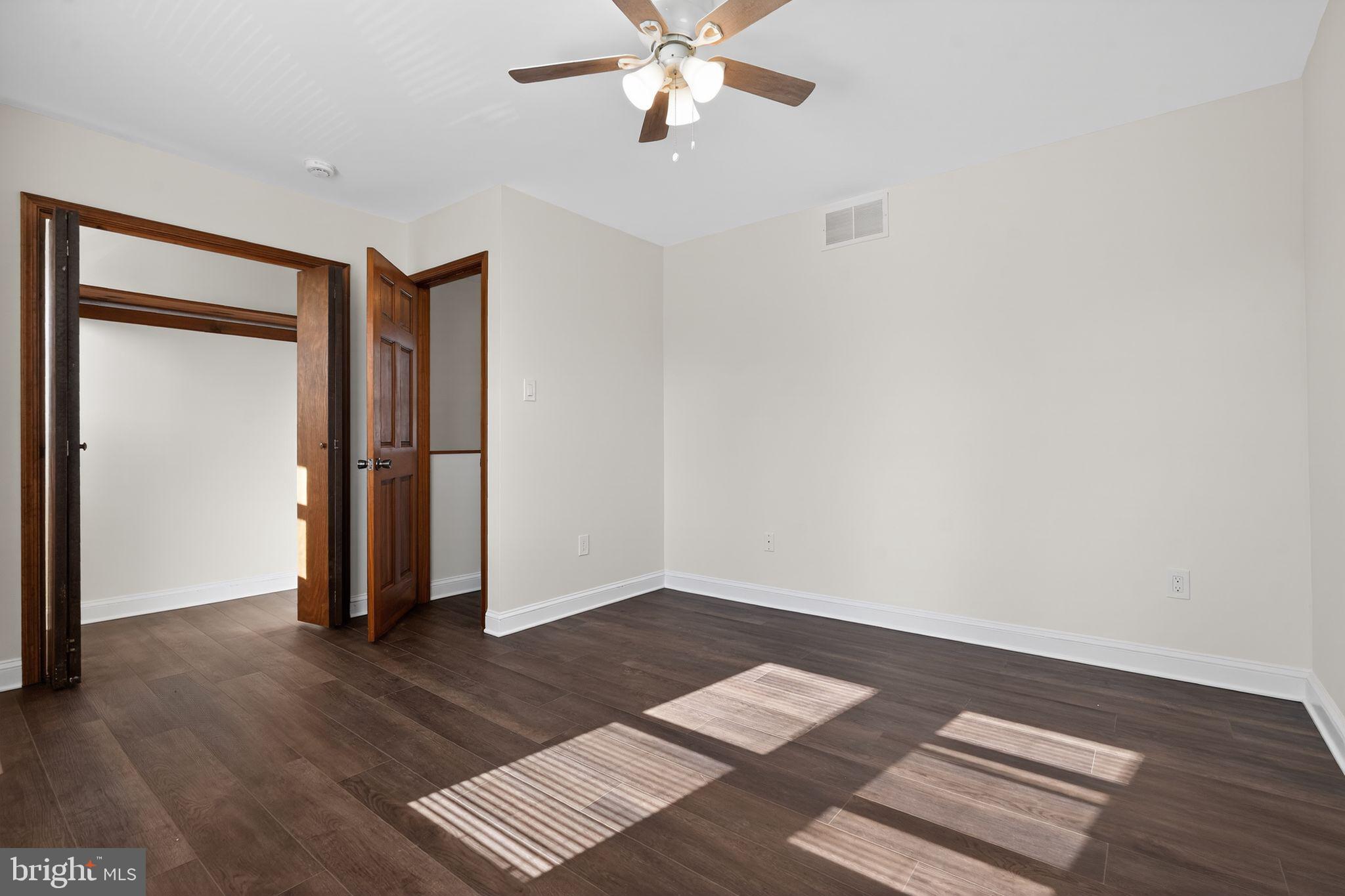 511 3rd Avenue Audubon, NJ 08106 - Photo 15 of 23 an empty room with wooden floor and closet