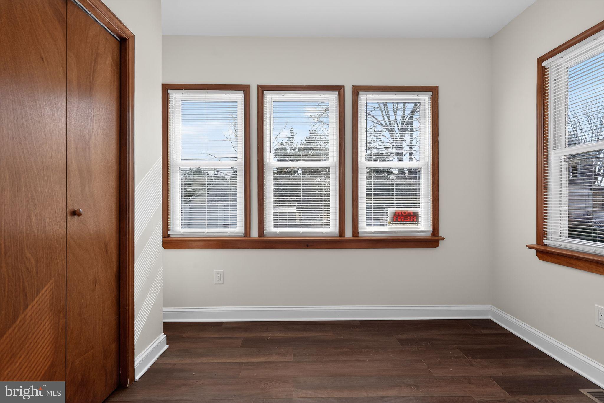 511 3rd Avenue Audubon, NJ 08106 - Photo 16 of 23 a view of an empty room with wooden floor and a window