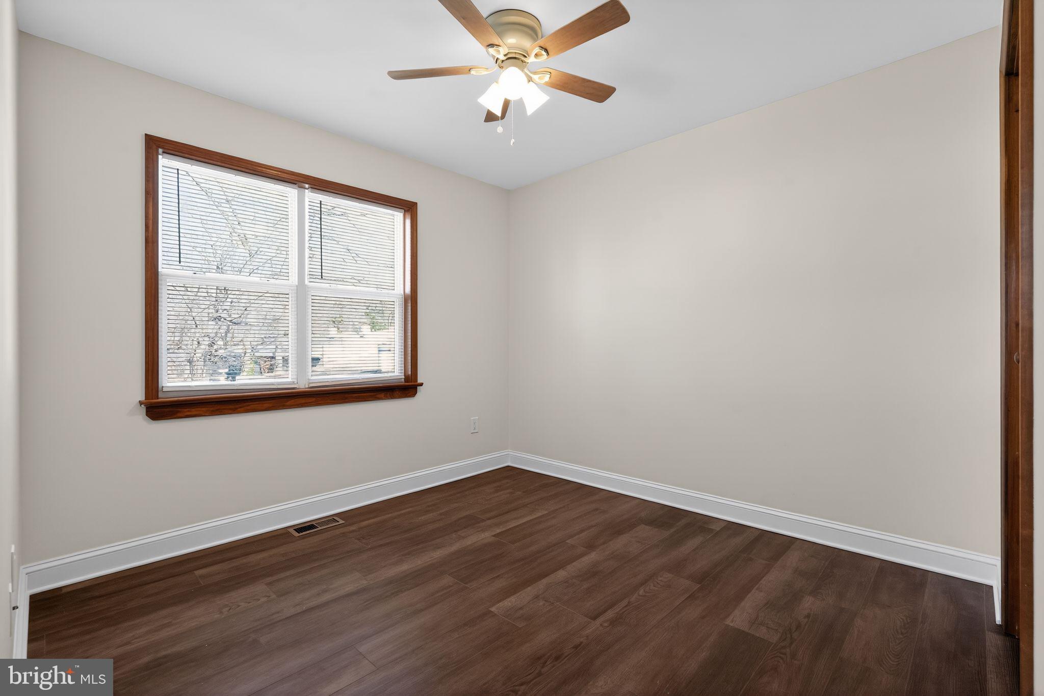 511 3rd Avenue Audubon, NJ 08106 - Photo 18 of 23 wooden floor in an empty room with a window
