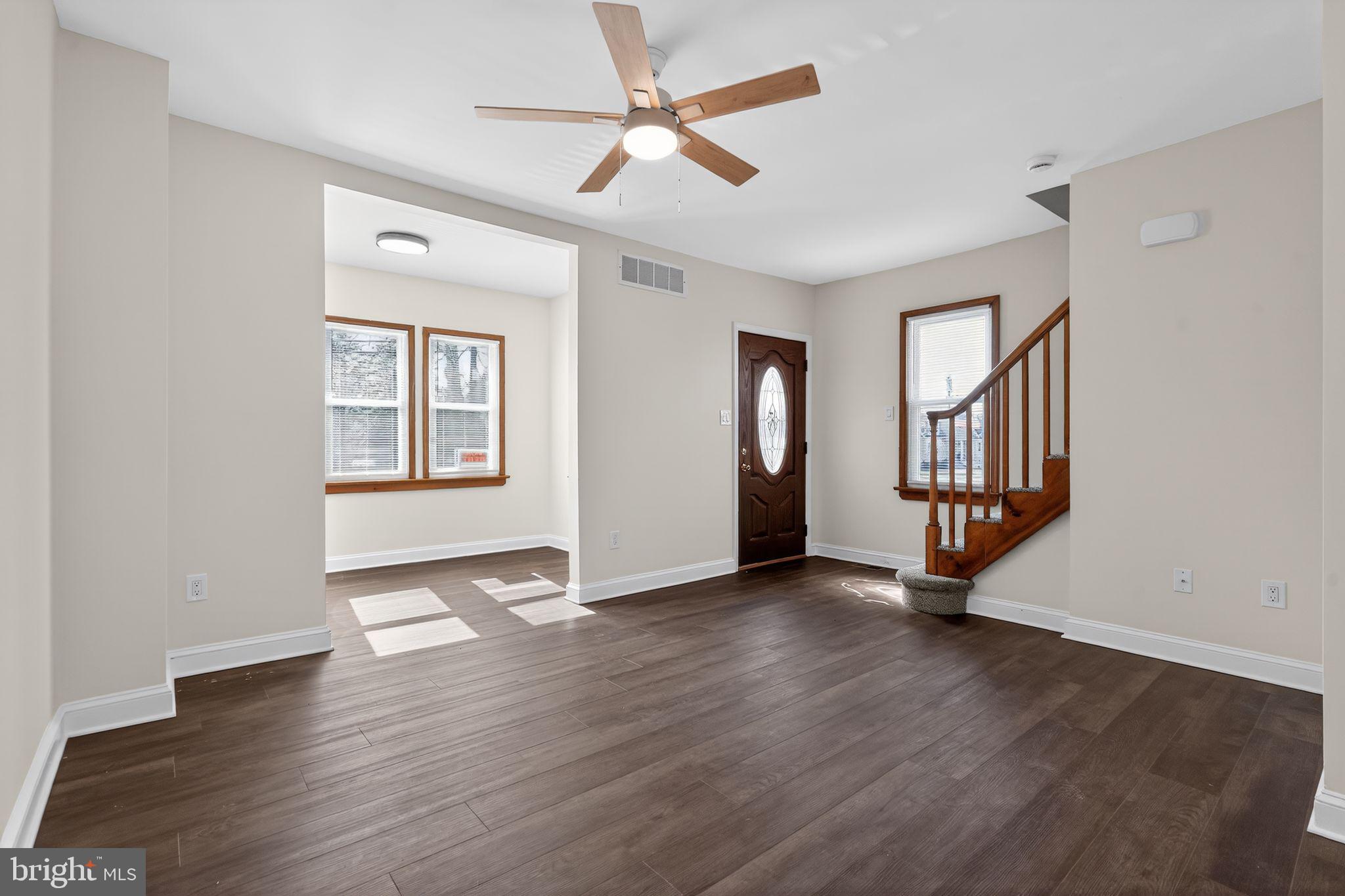 511 3rd Avenue Audubon, NJ 08106 - Photo 3 of 23 an empty room with wooden floor and windows