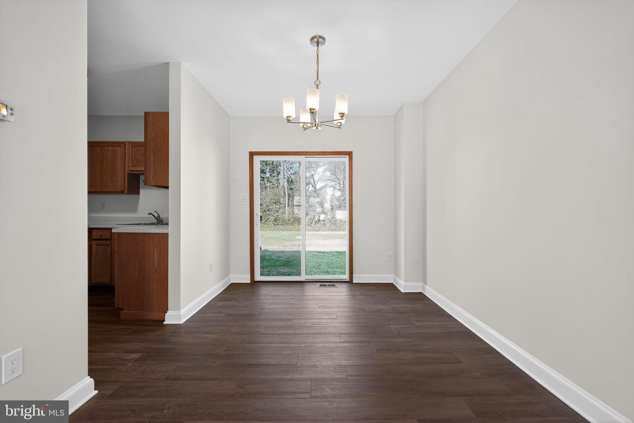 511 3rd Avenue Audubon, NJ 08106 - Photo 7 of 23 a view of livingroom with kitchen and wooden floor