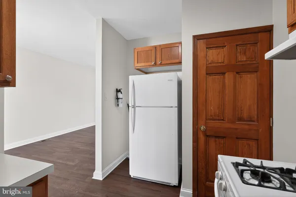 a view of kitchen with a refrigerator