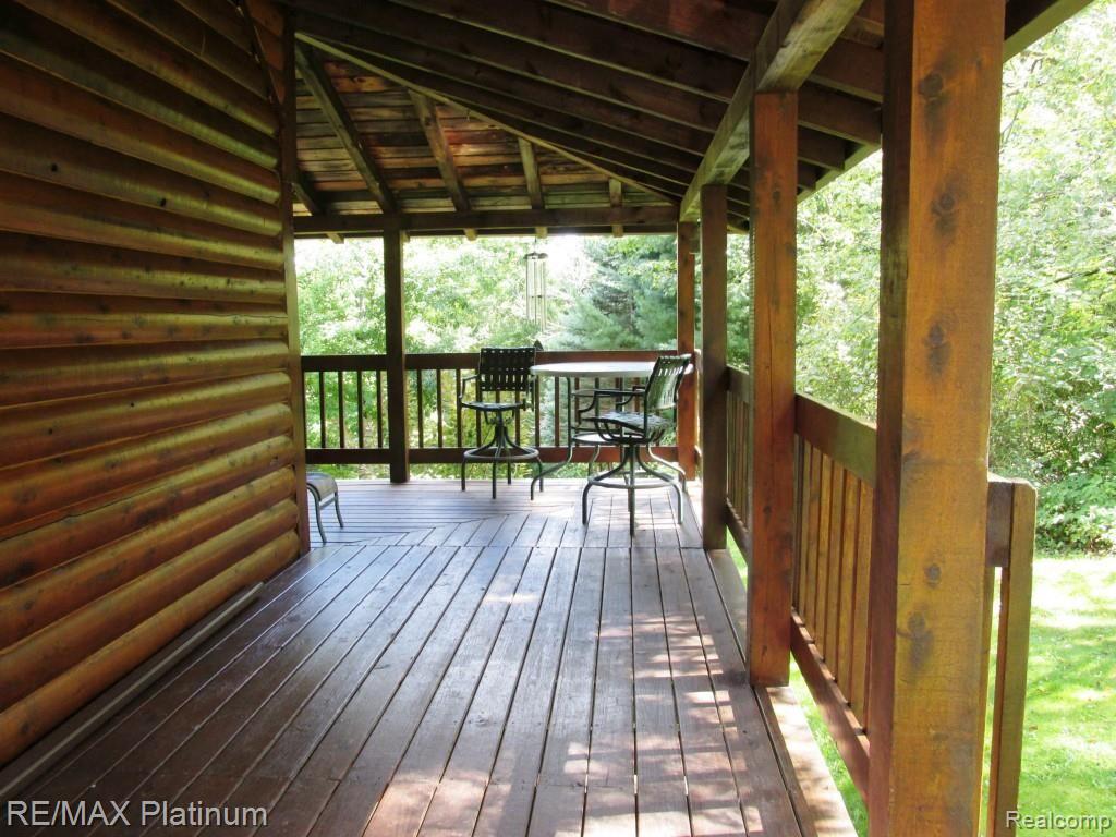 12296 Rohn Road Fenton, MI 48430 - Photo 29 of 38 8' WRAP AROUND PORCH ON S SIDE