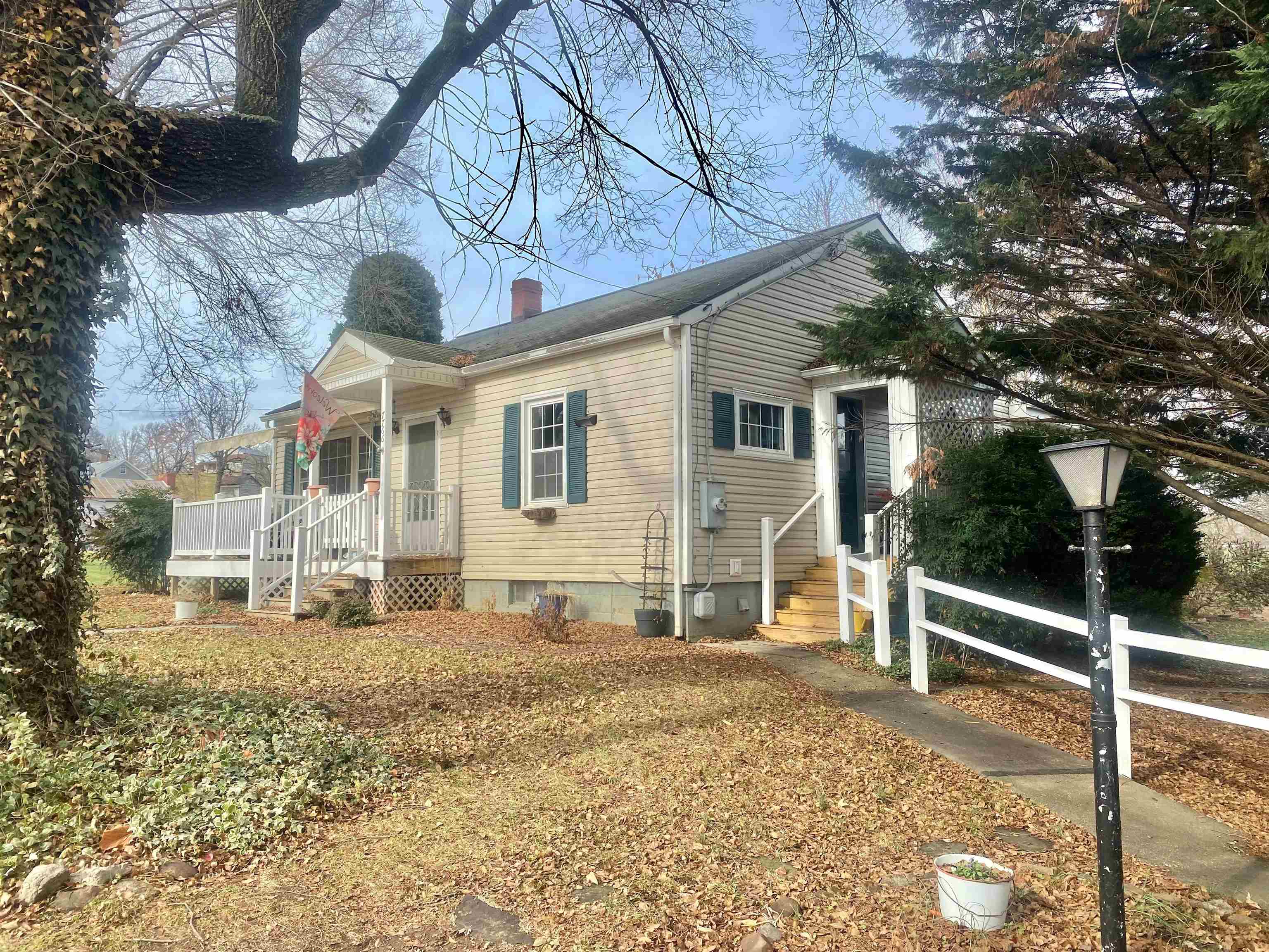7766 Thomas Spring Road Bridgewater, VA 22812 - Photo 22 of 24 a view of a house with a large tree and wooden fence
