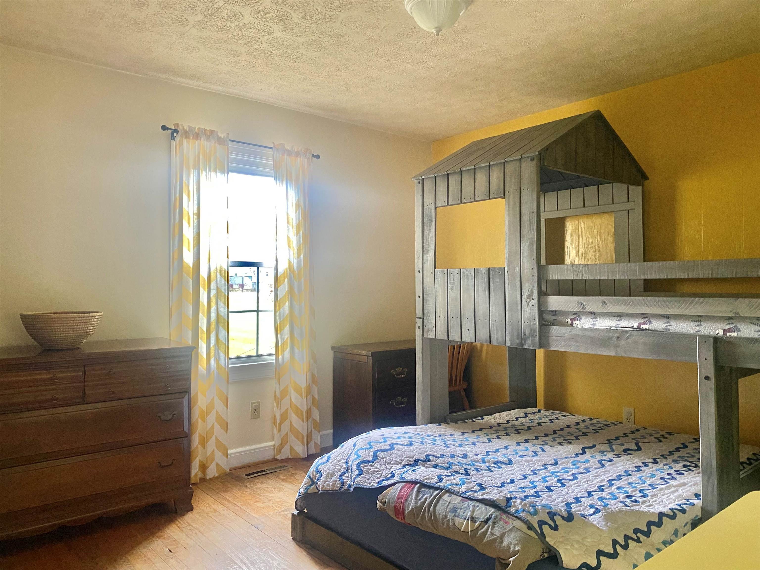 7766 Thomas Spring Road Bridgewater, VA 22812 - Photo 8 of 24 a bedroom with a bed and a dresser