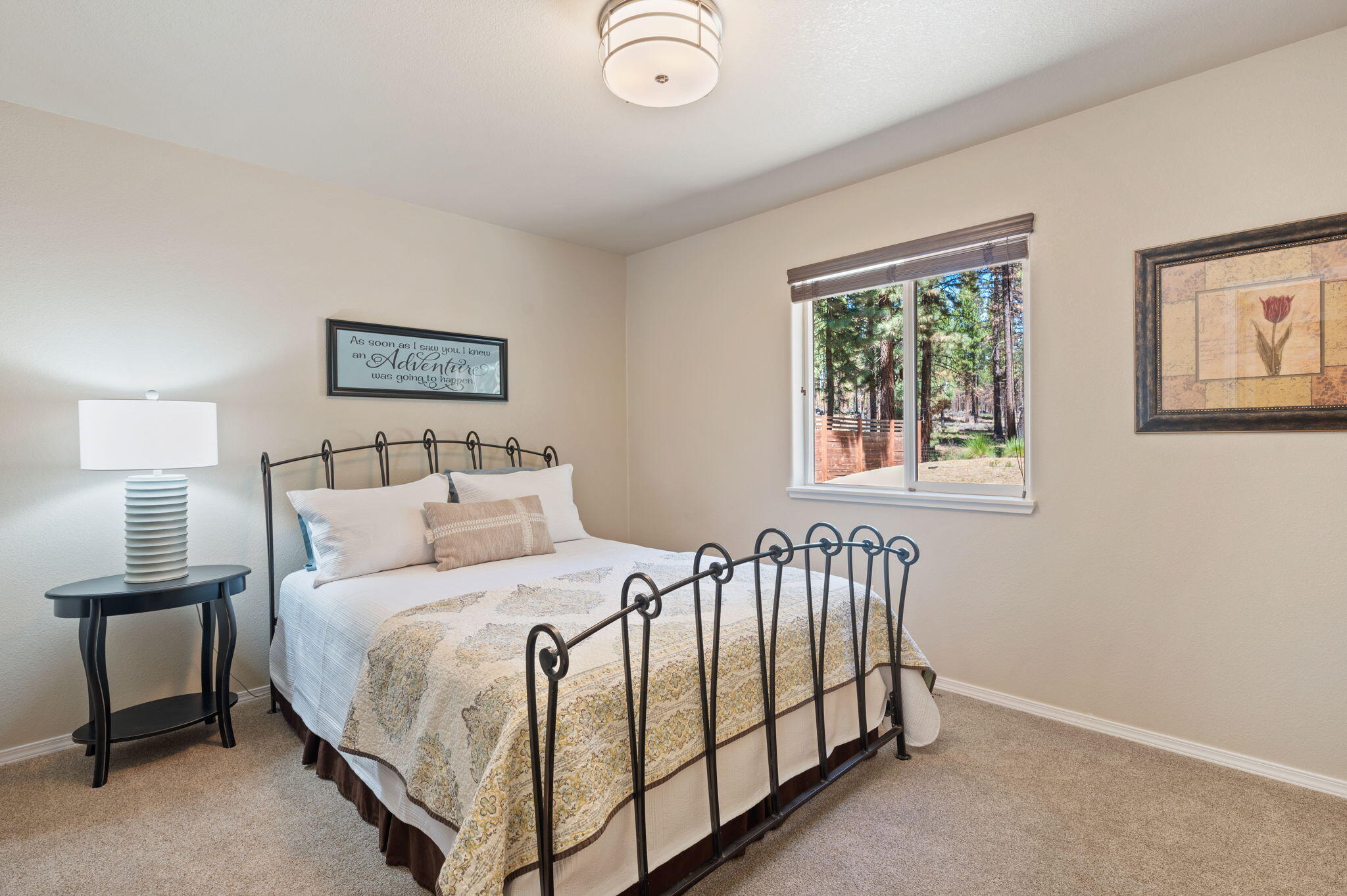 16938 Quartz Hill Road Bend, OR 97707 - Photo 29 of 52 a bedroom with a bed and a window
