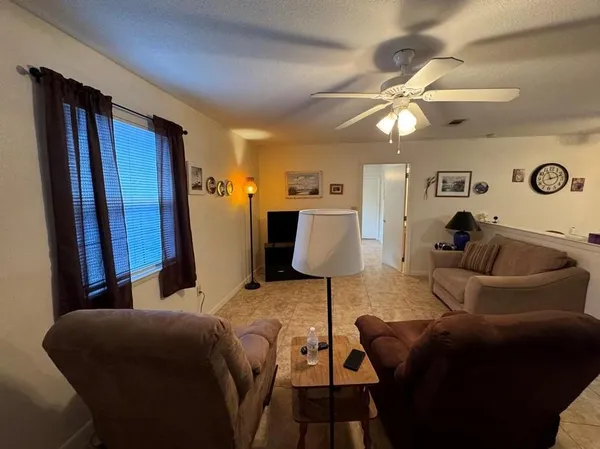 a living room with furniture and a rug