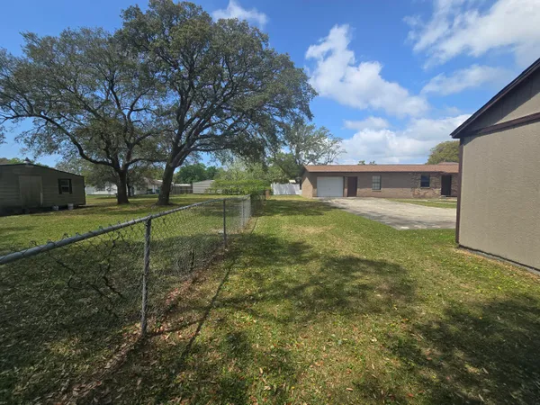 a house with yard in front of it