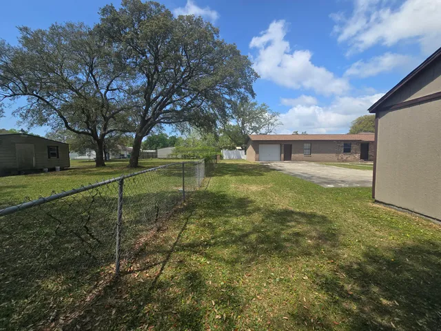 a house with yard in front of it
