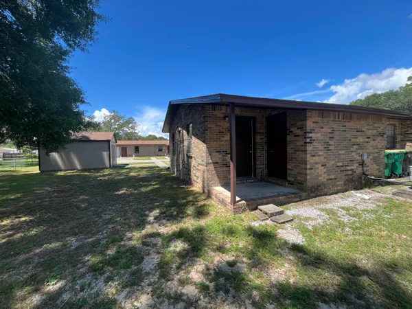 a house with trees in the background