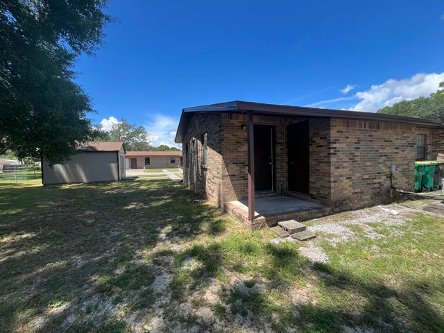 a house with trees in the background