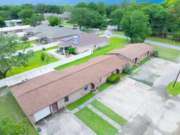 a view of a backyard with a garden and plants