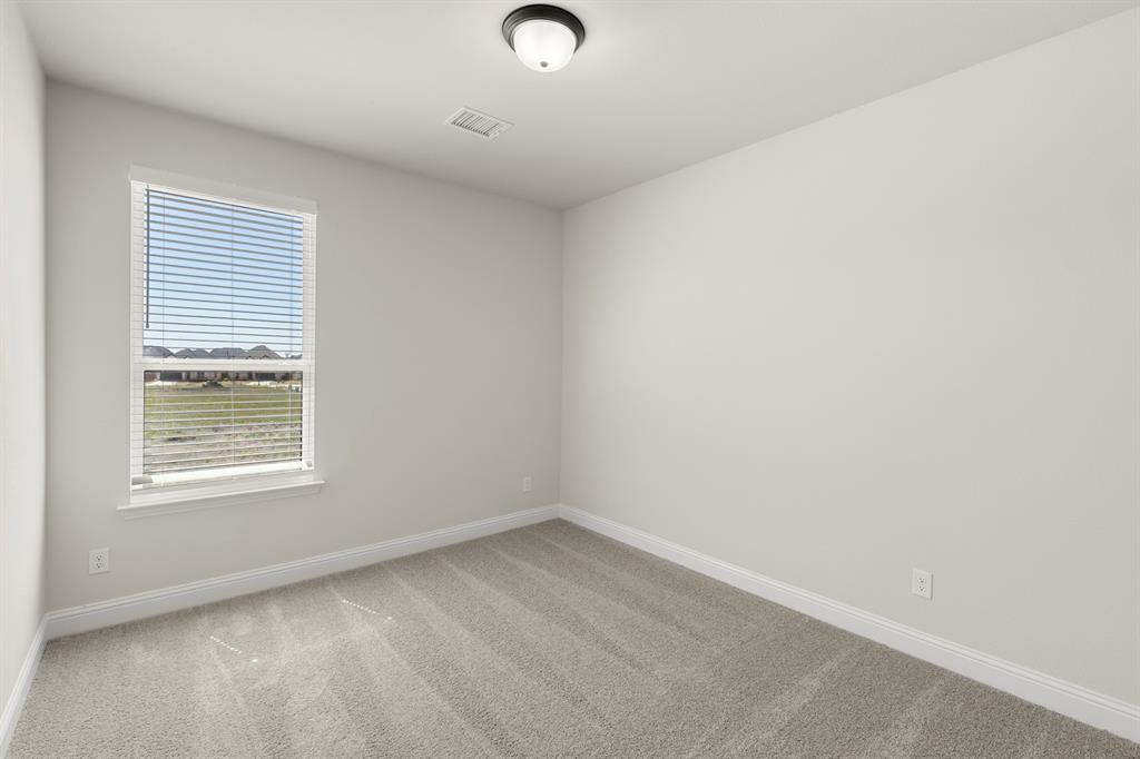 3916 Keya Drive Prosper, TX 75078 - Photo 17 of 28 an empty room with a window