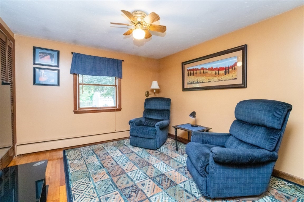 118 Bruce Road Walpole, MA 02081 - Photo 16 of 30 a living room with furniture and a rug