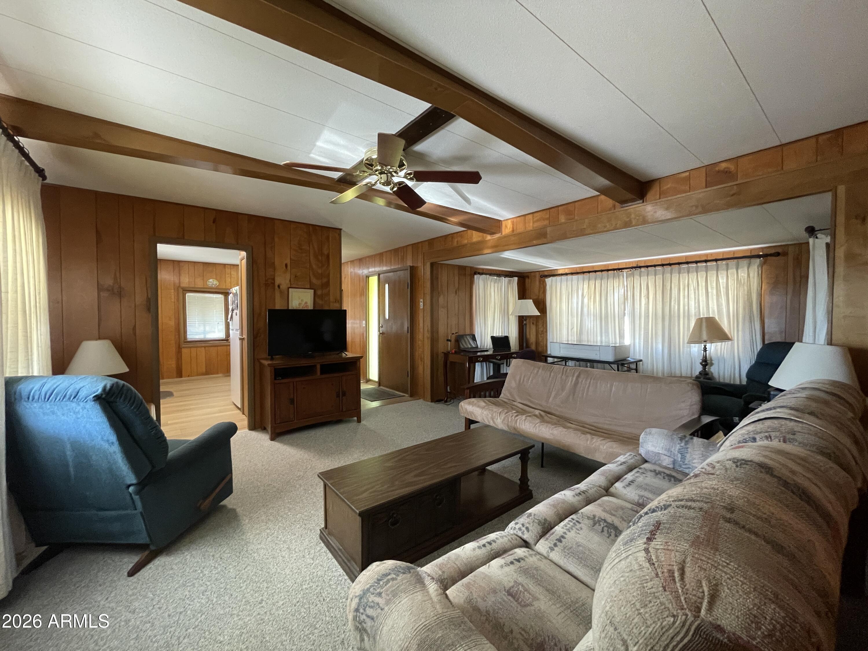 75 East Lynn Way Queen Valley, AZ 85118 - Photo 11 of 24 a living room with furniture ceiling fan and a rug