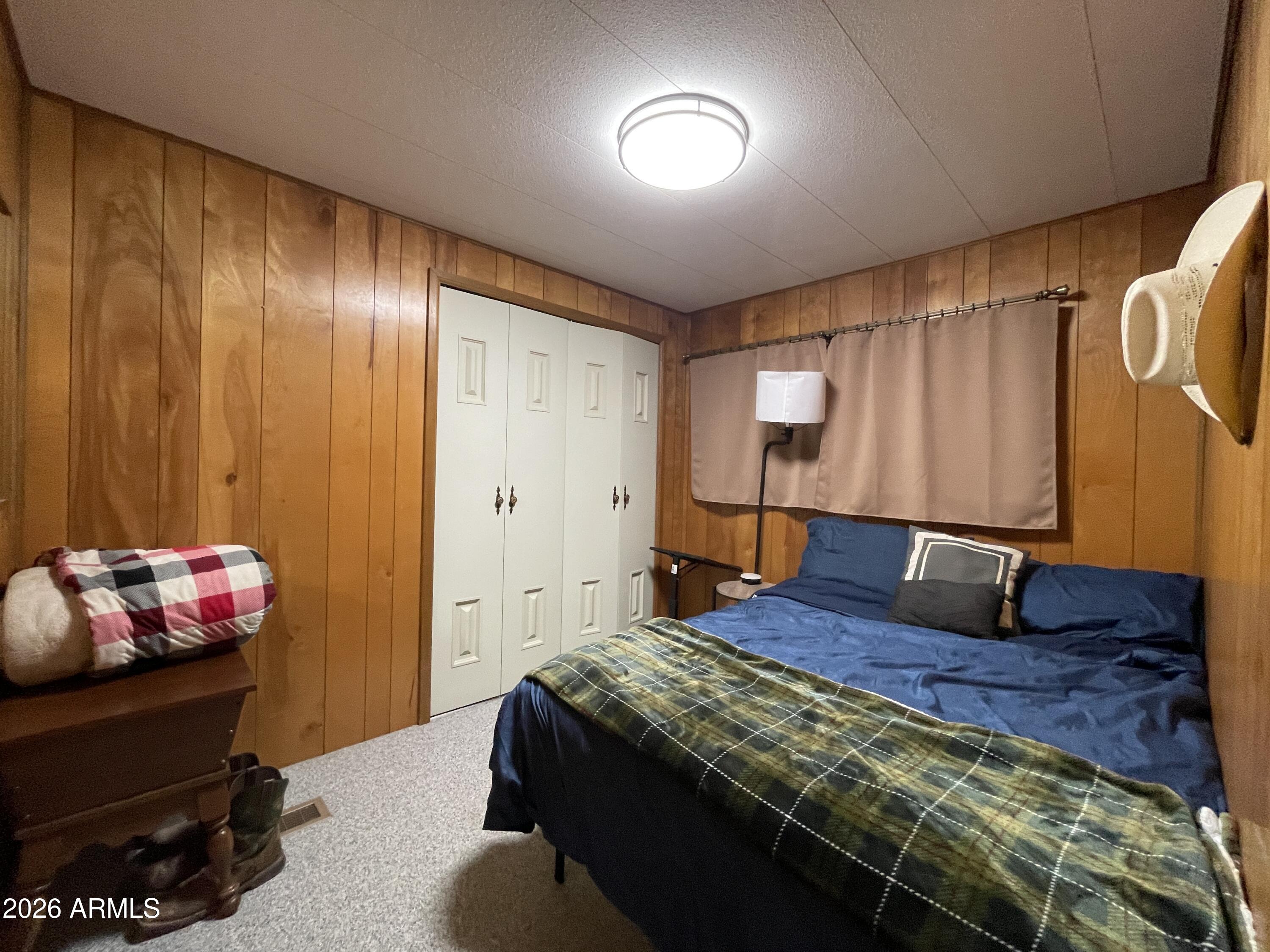 75 East Lynn Way Queen Valley, AZ 85118 - Photo 12 of 24 a bedroom with a bed and a window