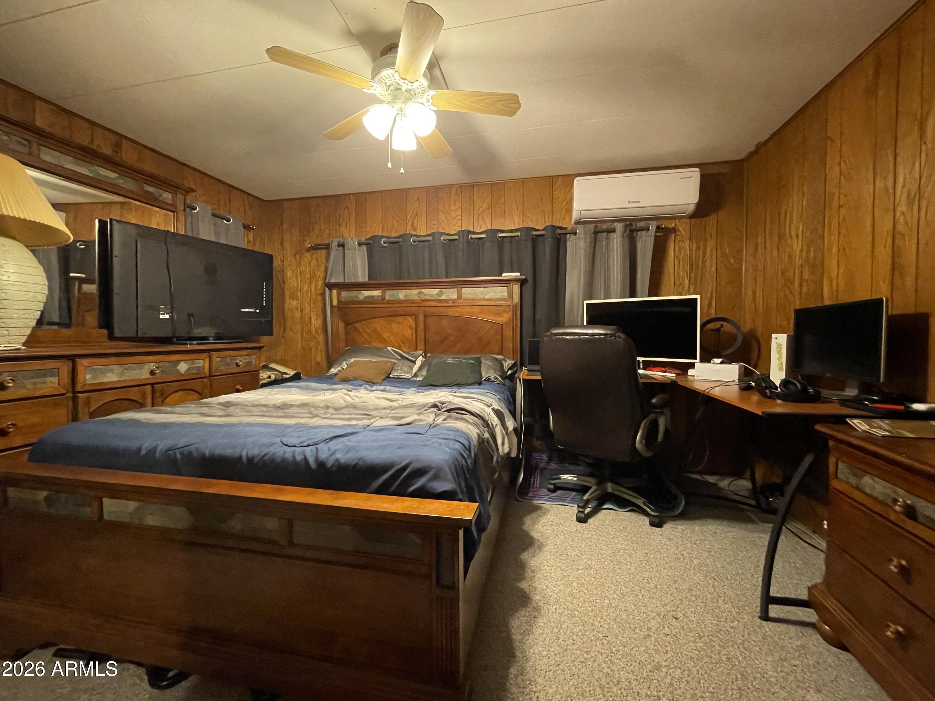 75 East Lynn Way Queen Valley, AZ 85118 - Photo 14 of 24 a bedroom with a bed and a television
