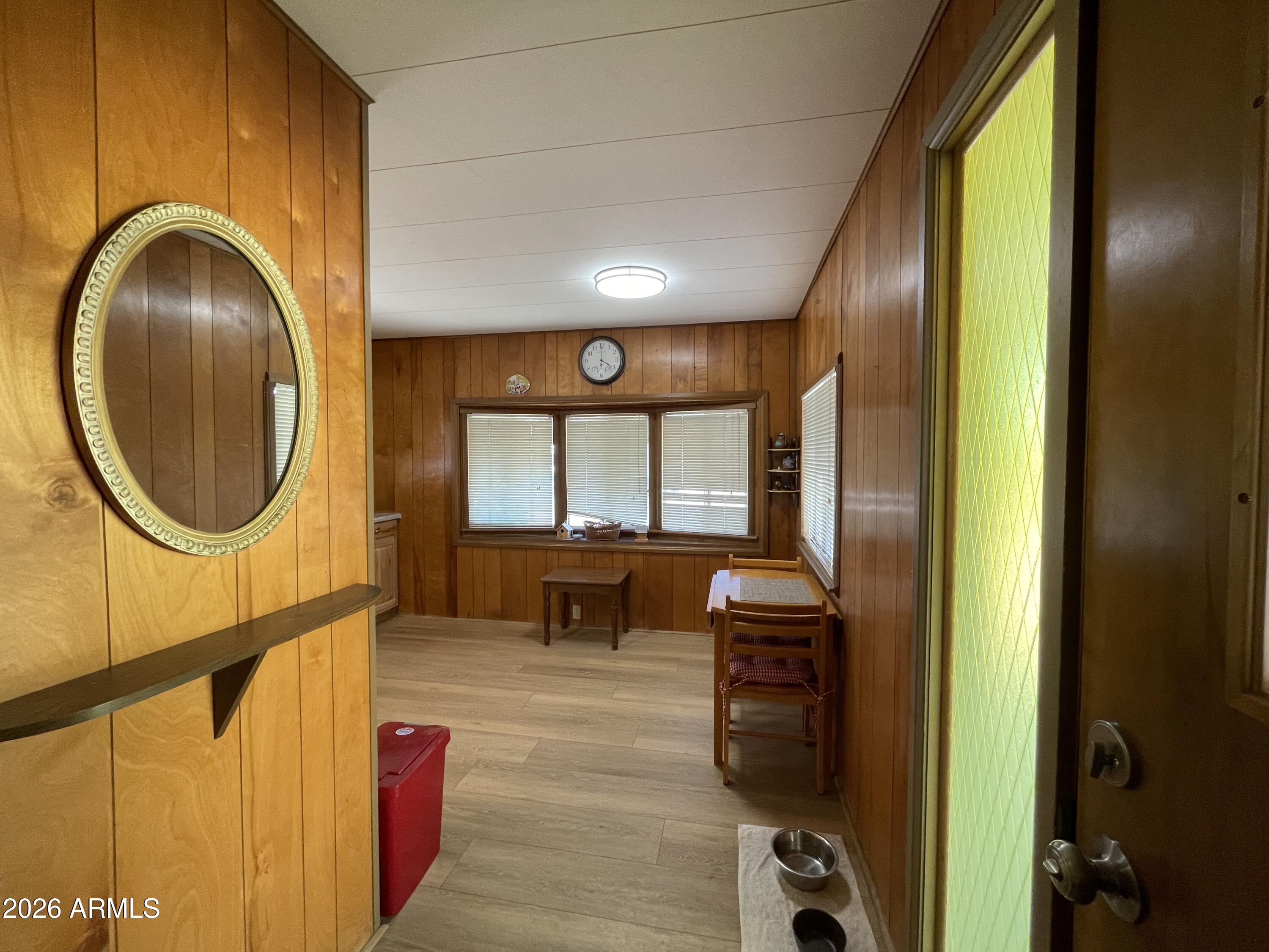 75 East Lynn Way Queen Valley, AZ 85118 - Photo 7 of 24 a view of a hallway with wooden floor and windows
