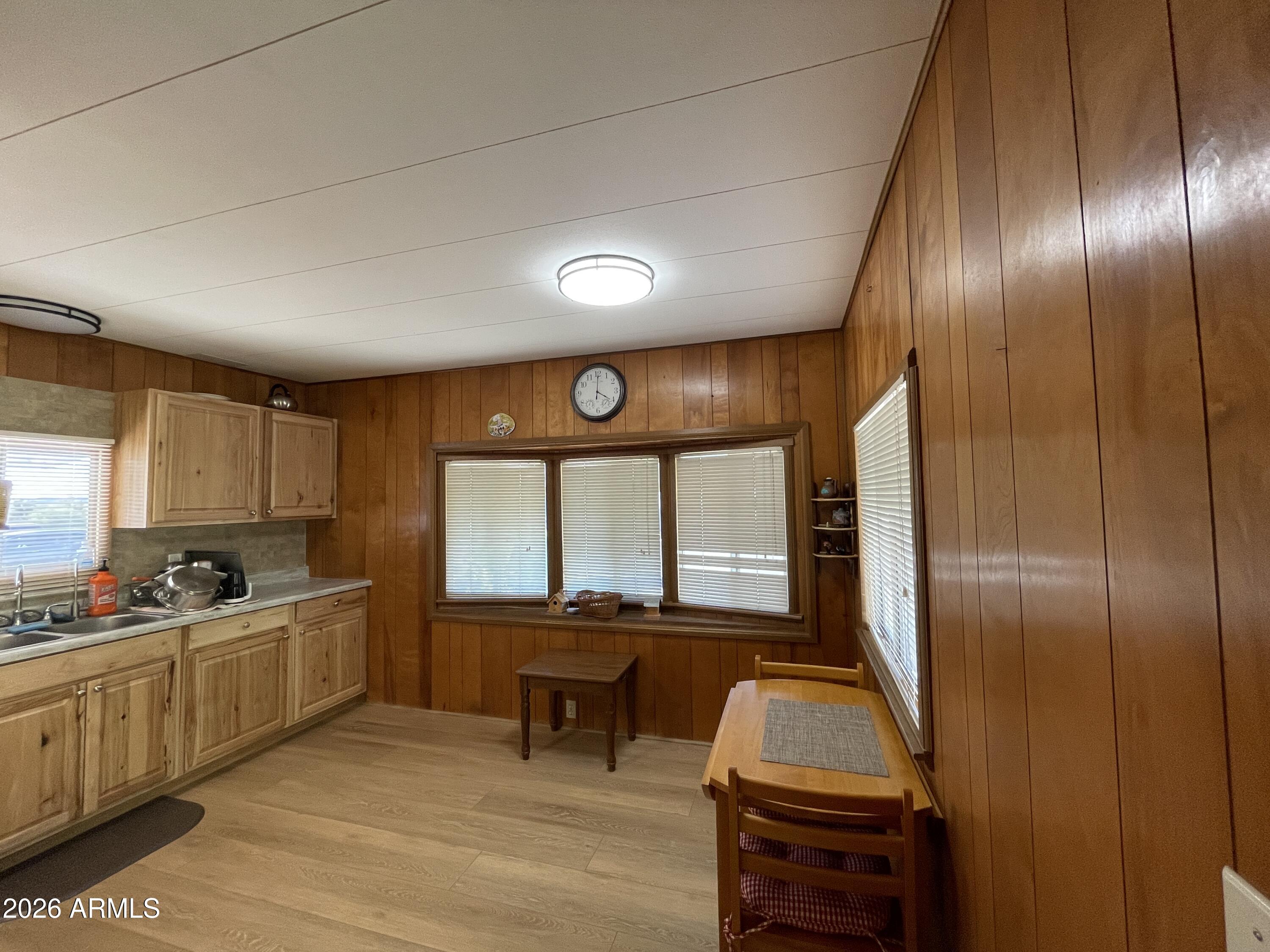 75 East Lynn Way Queen Valley, AZ 85118 - Photo 8 of 24 a kitchen with sink cabinets and window