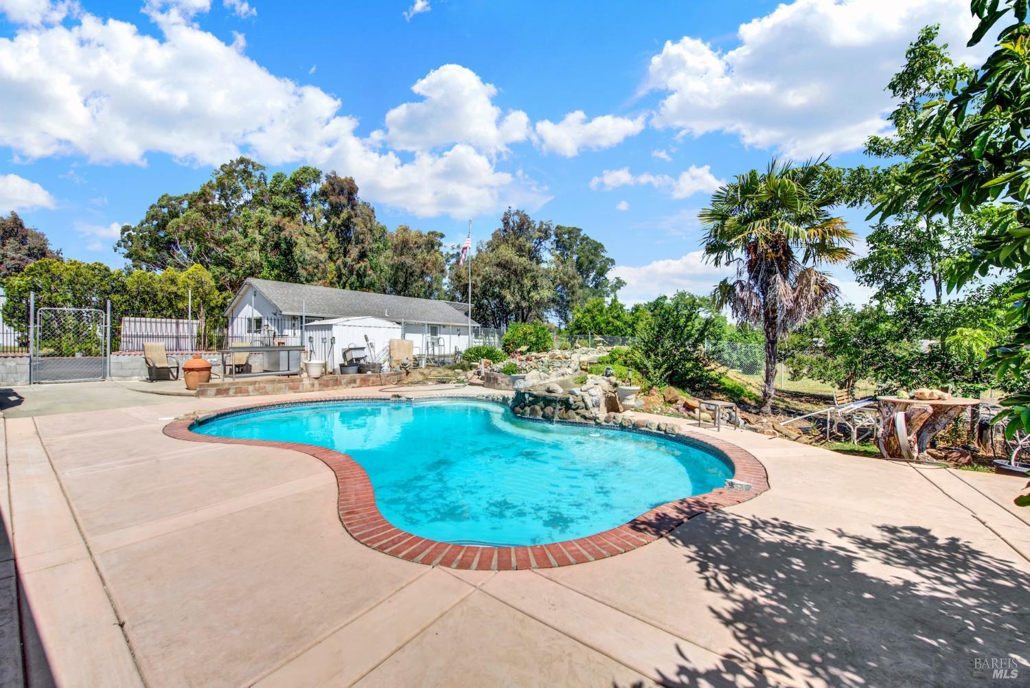 4851 Udell Road Vacaville, CA 95688 - Photo 32 of 65 a view of a swimming pool with an outdoor space
