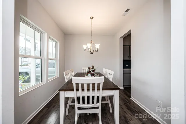 a view of a dining room with furniture window and chandelier