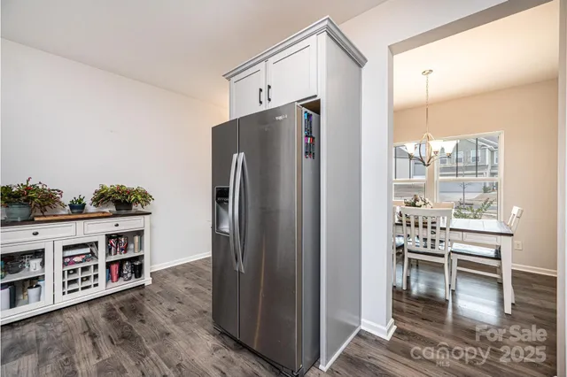 a kitchen with stainless steel appliances a refrigerator and a stove