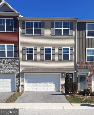 a view of a brick building with many windows