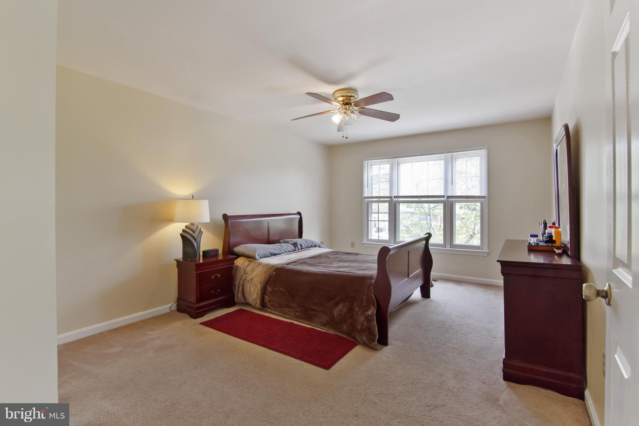 9304 Palmer Place, Unit 5 Laurel, MD 20708 - Photo 23 of 30 a bedroom with furniture and a window