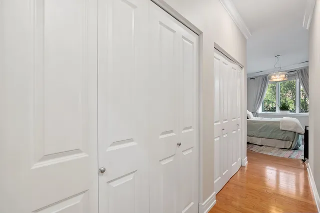 a view of a bedroom with furniture and window