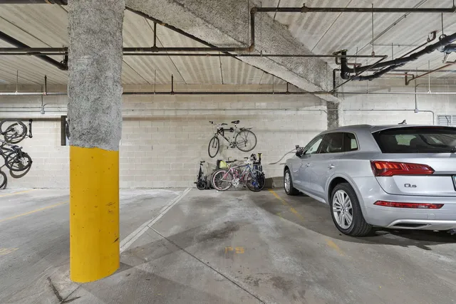 a view of garage with cars