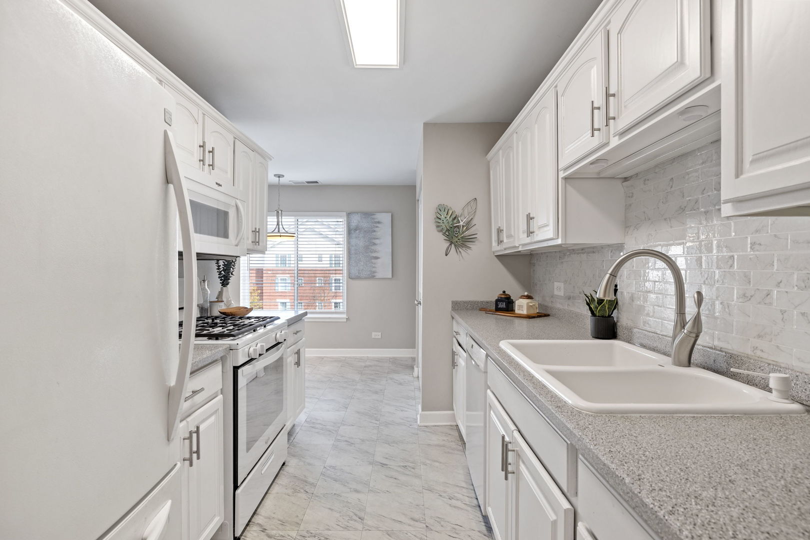 2201 South Grace Street, Unit 305 Lombard, IL 60148 - Photo 11 of 31 a kitchen with stainless steel appliances granite countertop a sink stove and refrigerator