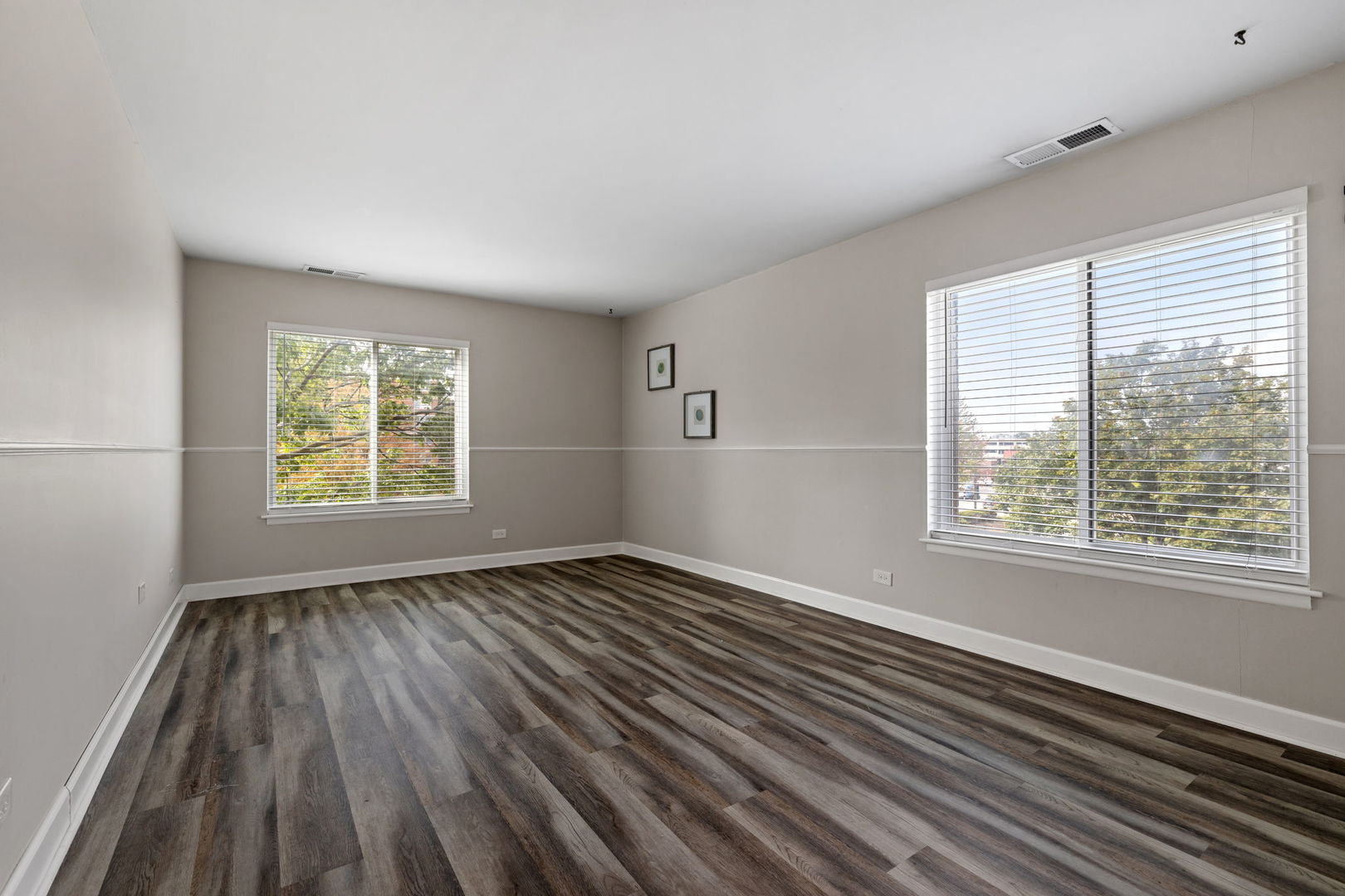 2201 South Grace Street, Unit 305 Lombard, IL 60148 - Photo 15 of 31 a view of an empty room with wooden floor and a window