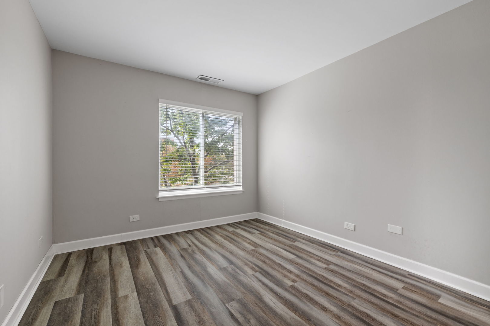 2201 South Grace Street, Unit 305 Lombard, IL 60148 - Photo 20 of 31 wooden floor in an empty room with a window