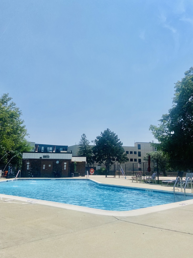 2201 South Grace Street, Unit 305 Lombard, IL 60148 - Photo 26 of 31 a front view of a house with a yard