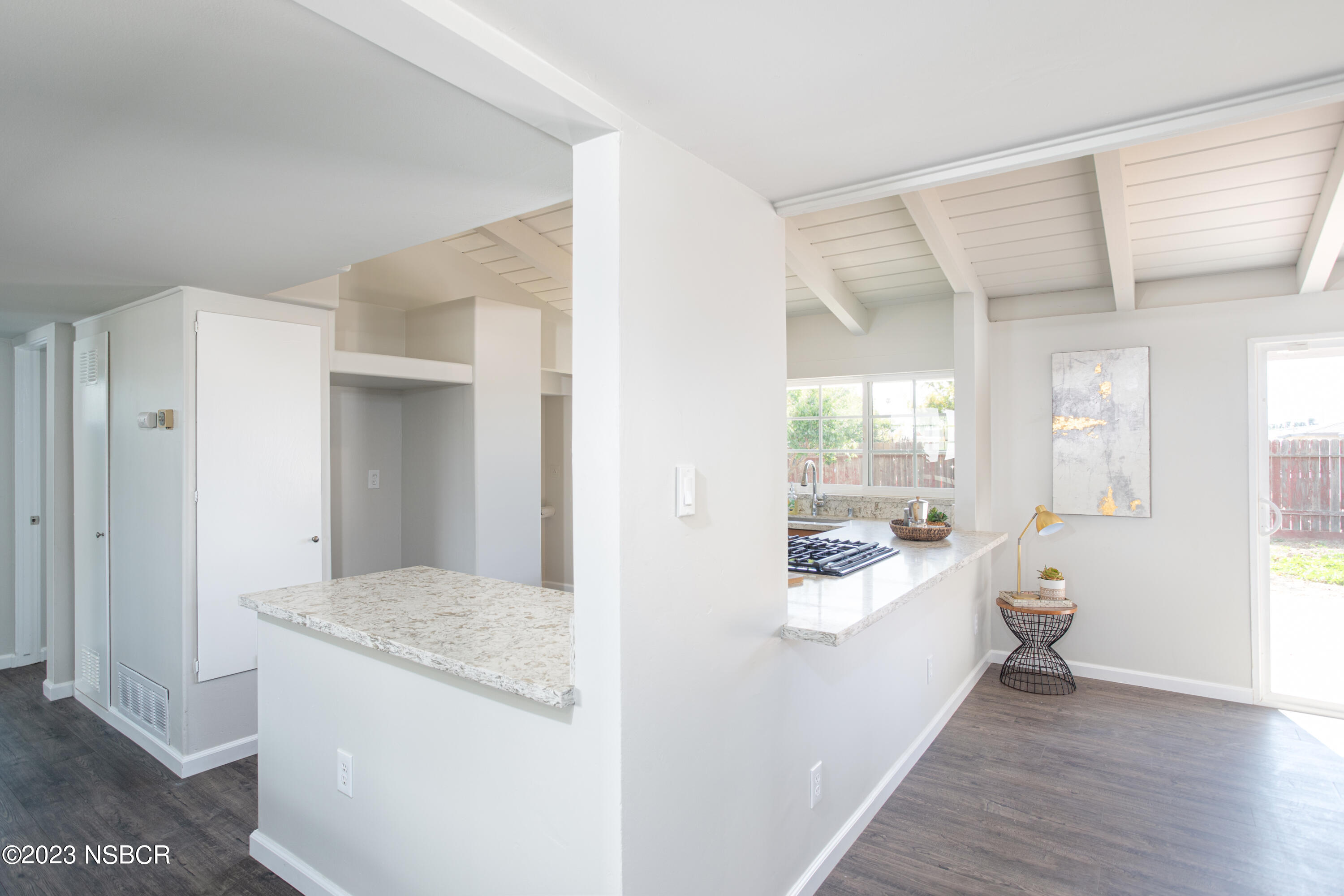 303 North Third Street Lompoc, CA 93436 - Photo 15 of 31 a kitchen with a sink dishwasher stove and refrigerator