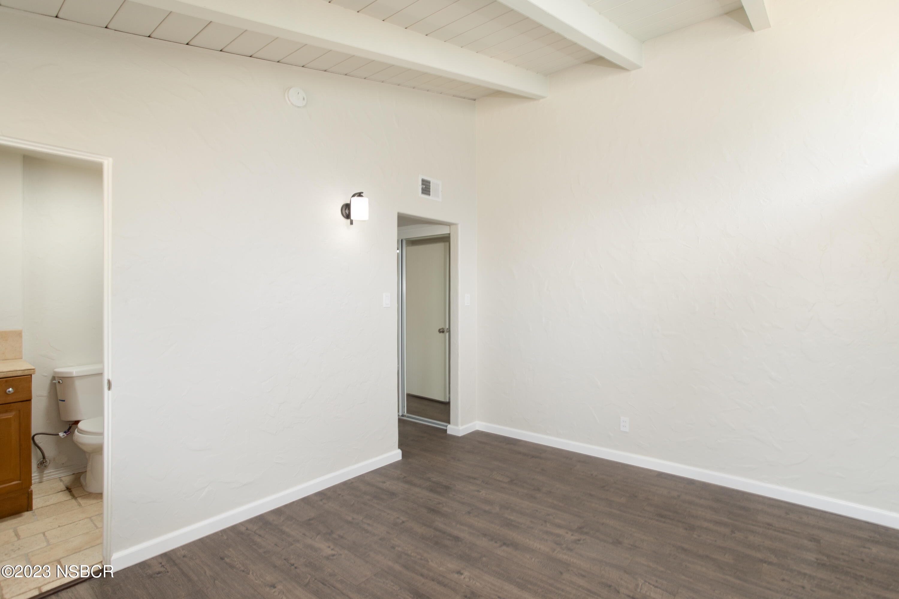 303 North Third Street Lompoc, CA 93436 - Photo 21 of 31 a view of an empty room with wooden floor