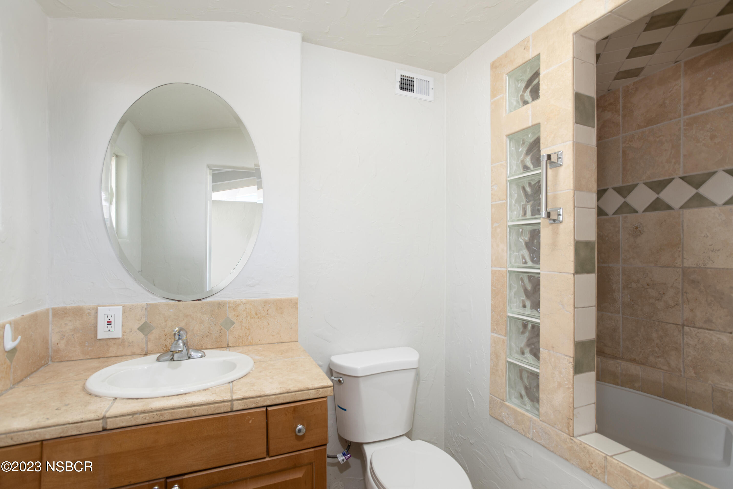 303 North Third Street Lompoc, CA 93436 - Photo 22 of 31 a bathroom with a sink and a mirror