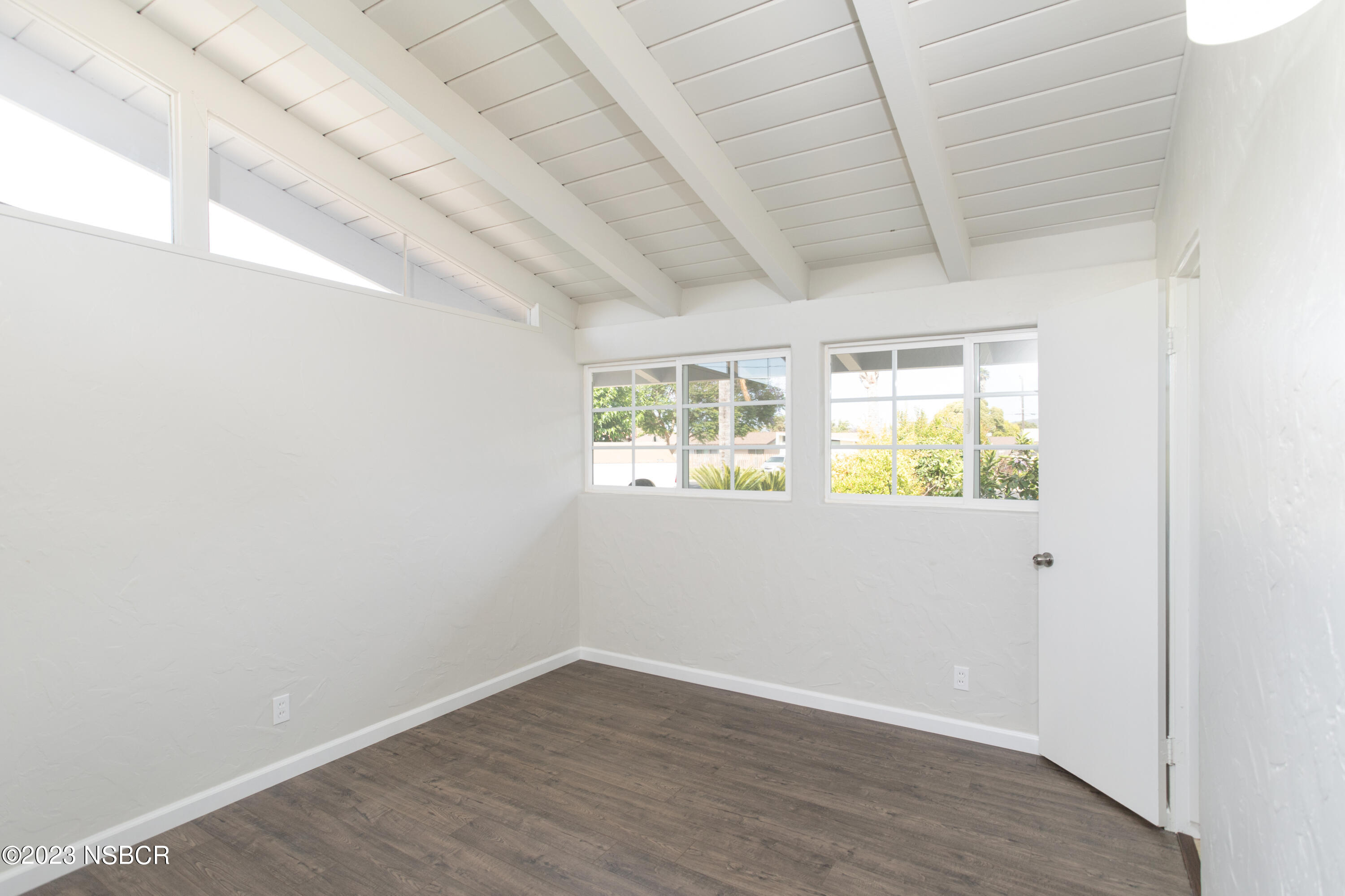 303 North Third Street Lompoc, CA 93436 - Photo 24 of 31 a view of an empty room with wooden floor and a window