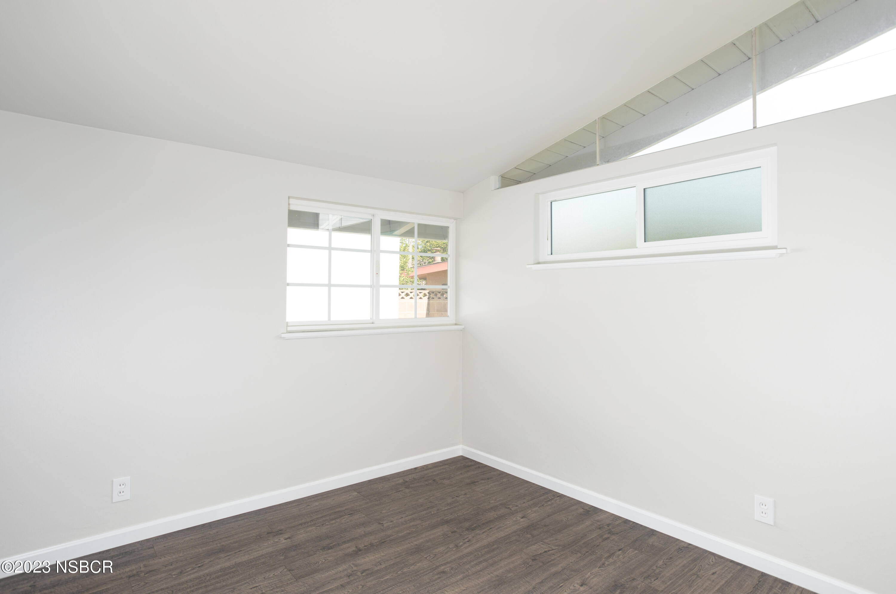 303 North Third Street Lompoc, CA 93436 - Photo 26 of 31 a room with a window and wooden floor