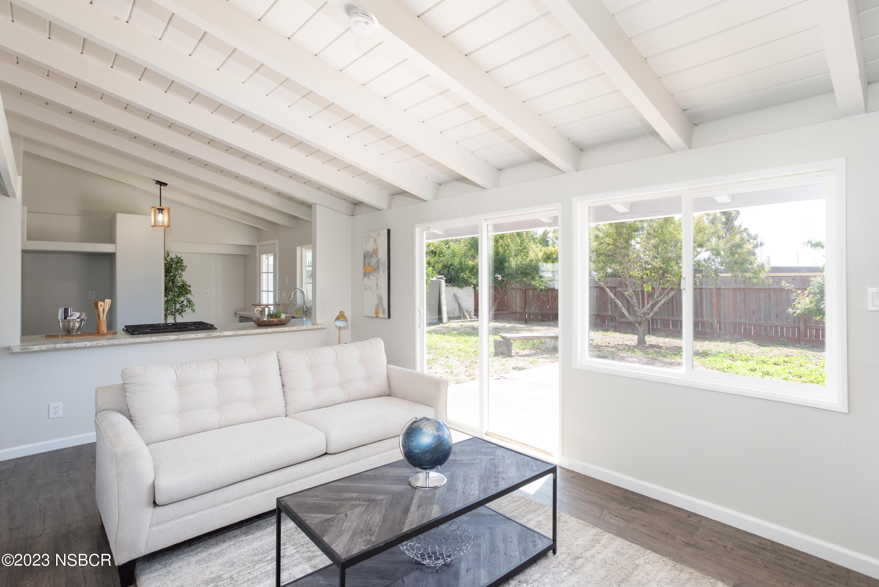 303 North Third Street Lompoc, CA 93436 - Photo 6 of 31 a living room with furniture and a large window